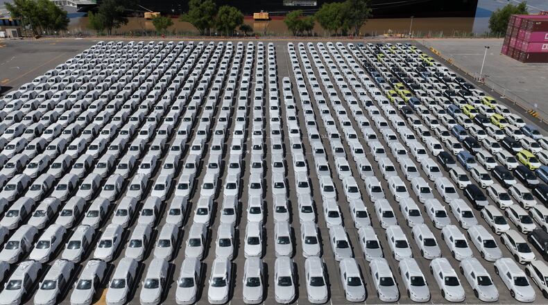 The BYD Changzhou car carrier is docked at Terminal Zarate in the Buenos Aires province of Argentina, Tuesday, Jan. 20, 2026, where hybrid and electric vehicles shipped from China are parked next to the ship. (AP Photo/Victor R. Caivano)