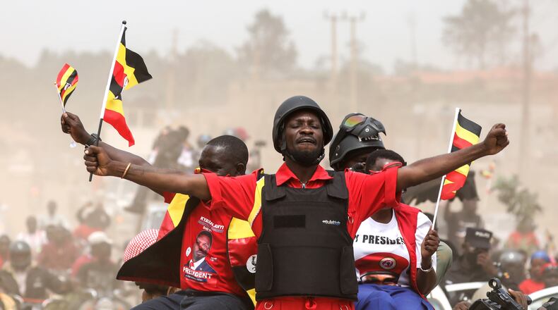 Uganda opposition presidential candidate Robert Kyagulanyi Ssentamu, who is known as Bobi Wine waves to supporters at an election campaign rally in Mukono, Uganda, Friday, Jan. 9, 2026. (AP Photo/Hajarah Nalwadda)