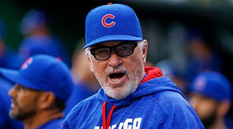 Chicago Cubs manager Joe Maddon stands in the dugout before a baseball game against the Pittsburgh Pirates in Pittsburgh, Tuesday, May 3, 2016. (AP Photo/Gene J. Puskar)