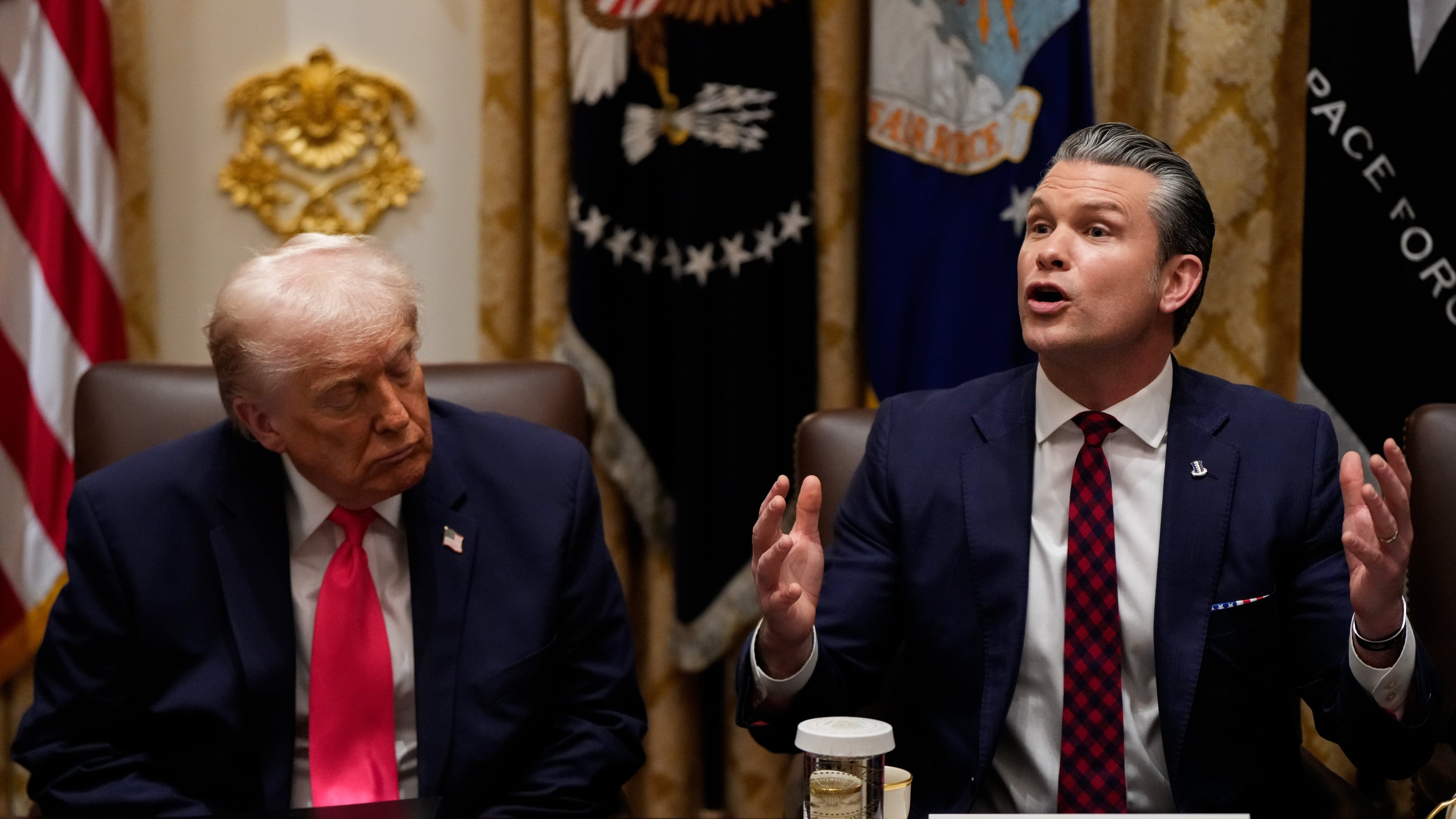 President Donald Trump closes his eyes as Defense Secretary Pete Hegseth speaks during a Cabinet meeting at the White House, Tuesday, Dec. 2, 2025, in Washington. (AP Photo/Julia Demaree Nikhinson)