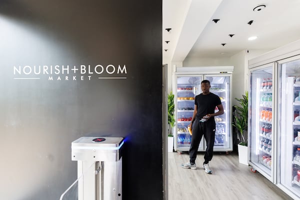 Samaje Carter checks out the newly opened Nourish + Bloom Market in Pittsburgh Yards in Atlanta on Thursday, June 25, 2026. (Estela Muñoz/AJC) 