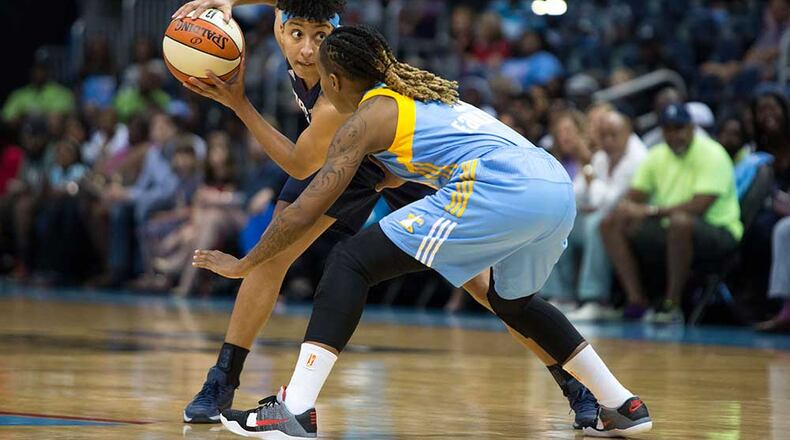 Atlanta's Layshia Clarendon looks to make a pass around Chicago's Jamierra Faulkner (21).