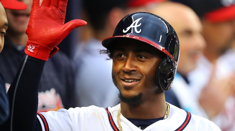 March 29, 2018 Atlanta: Braves second baseman Ozzie Albies celebrates hitting a solo homerun against the Phillies during the eight inning in a MLB baseball home opening game on Thursday, March 29, 2018, in Atlanta.  Curtis Compton/ccompton@ajc.com