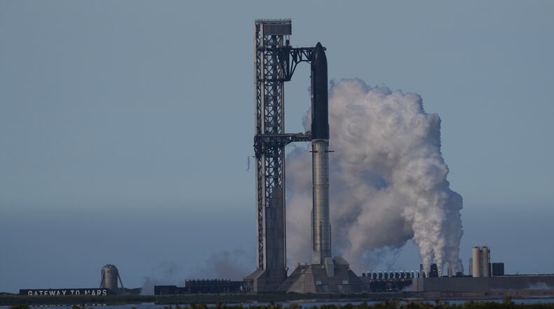 SpaceX's mega rocket Starship is prepared for a test flight that was later delayed, in Starbase, Texas, Thursday, May 21, 2026. (AP Photo/Eric Gay)