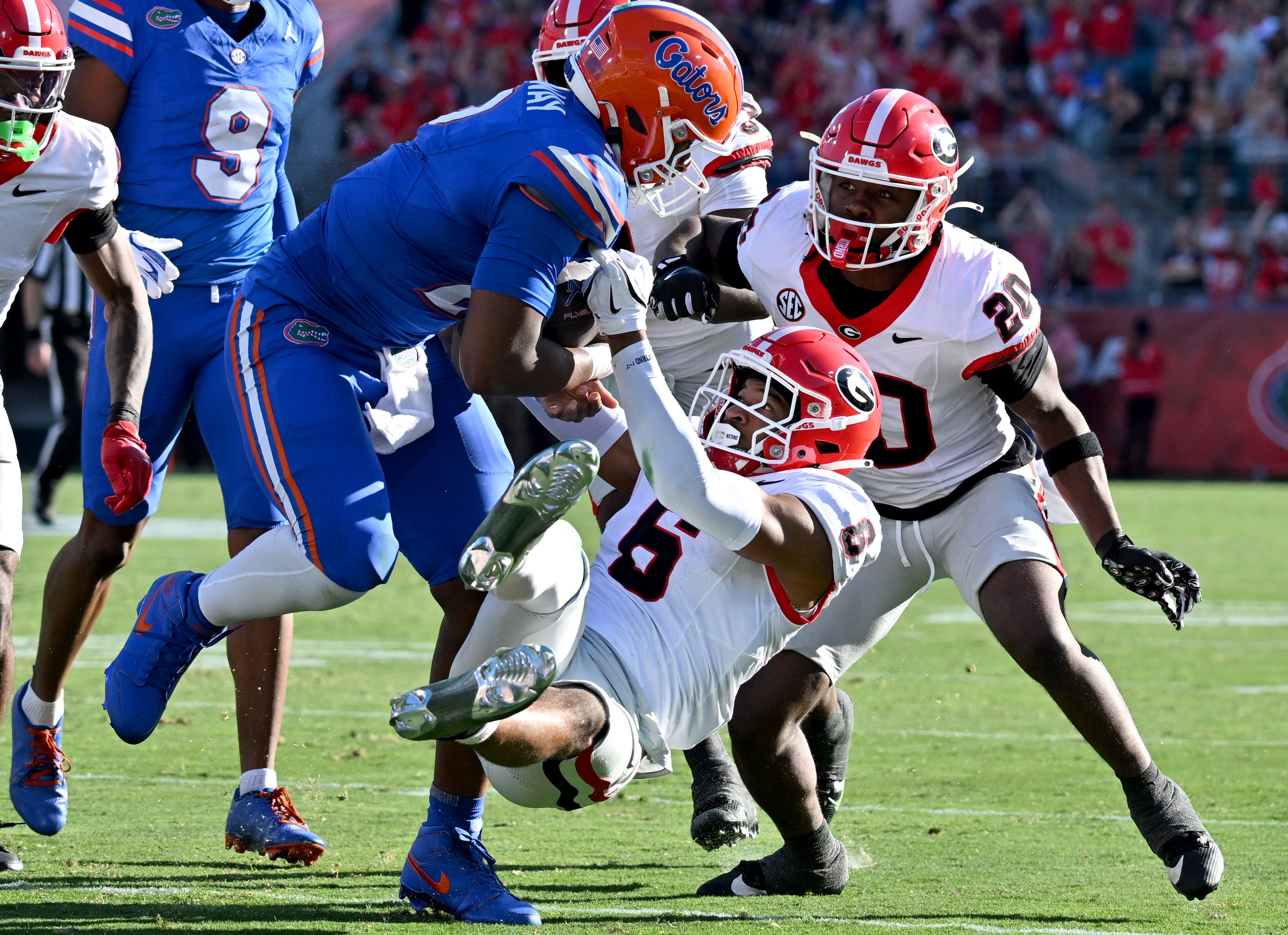 Florida quarterback DJ Lagway (2) is sacked by Georgia defensive back Daylen Everette (6) during the first half in an NCAA football game, Saturday, November 1, 2025, Jacksonville, Fla. (Hyosub Shin / AJC)