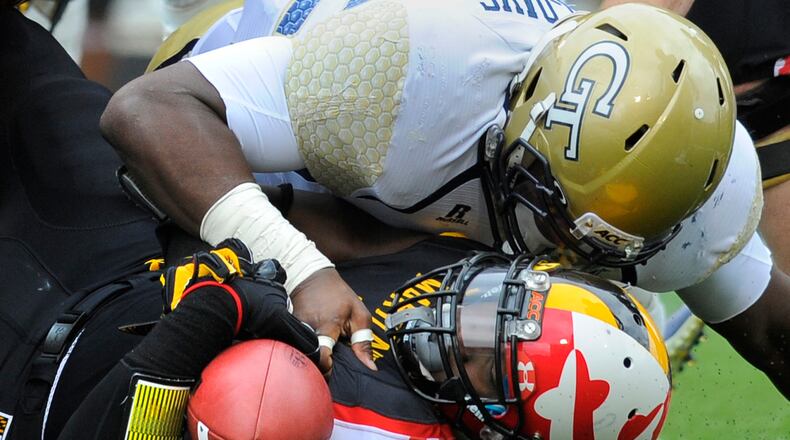 Georgia Tech's Jabari Hunt-Days tackles Maryland's Wes Brown during first quarter action.