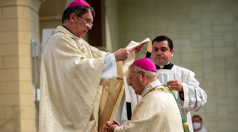 Archbishop Gregory J. Hartmayer receives the sacred pallium, which is blessed by the pope, from the apostolic nuncio, Archbishop Christophe Pierre, in a ceremony at the St. Peter Chanel Catholic Church in Roswell Wednesday, Oct. 7, 2020. Pope Francis decided in 2015 that new archbishops would receive the pallium in their home diocese instead of in Rome. (Steve Schaefer for The Atlanta Journal-Constitution)