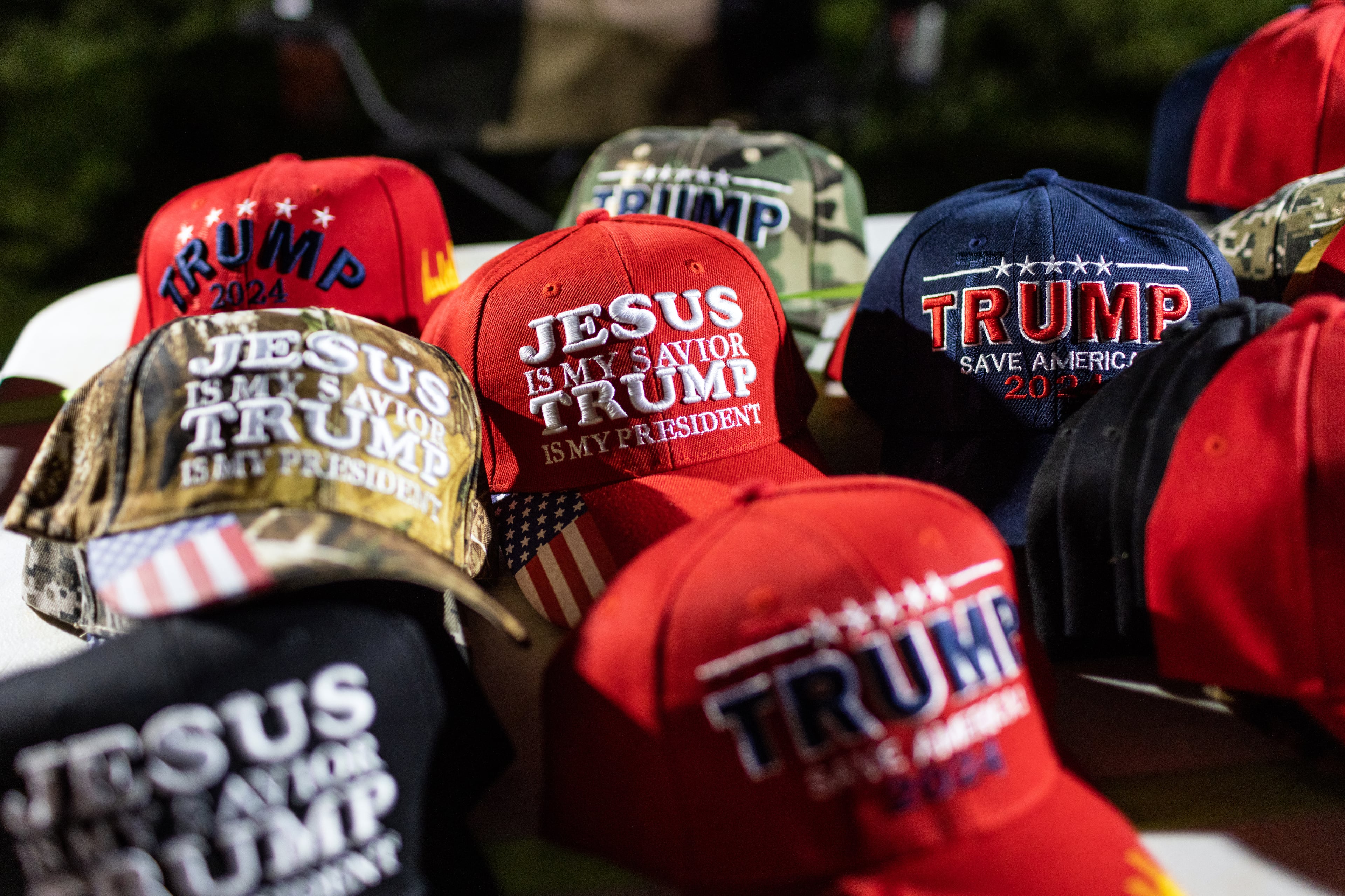 Hats for sale at a campaign rally for Donald Trump in Commerce, Ga., in 2022.