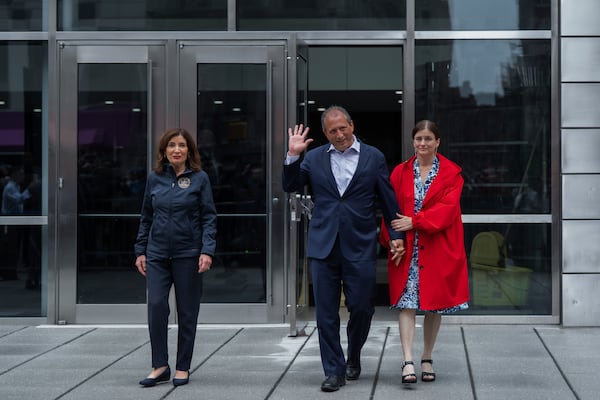New York City Comptroller Brad Lander, center, leaves Jacob K. Javits Federal Building with wife, Meg Barnette, right, and New York Gov. Kathy Hochul, left, after being released from arrest outside federal immigration court on Tuesday, June 17, 2025, in New York. (AP Photo/Olga Fedorova)