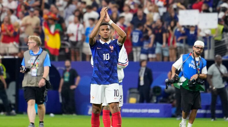 France's Kylian Mbappe (10) applauds after the World Cup semifinal soccer match between France and Spain in Arlington, Texas, near Dallas, Tuesday, July 14, 2026. (AP Photo/Tony Gutierrez)