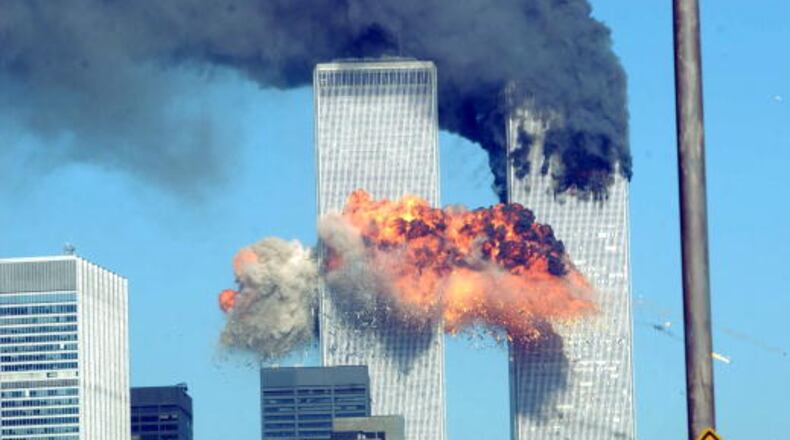 394261 14: A fiery blasts rocks the World Trade Center after being hit by two planes September 11, 2001 in New York City. (Photo by Spencer Platt/Getty Images)