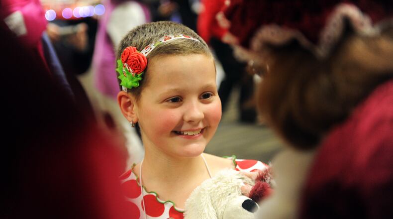 Esme Miller, 10, chats with Mrs. Claus.