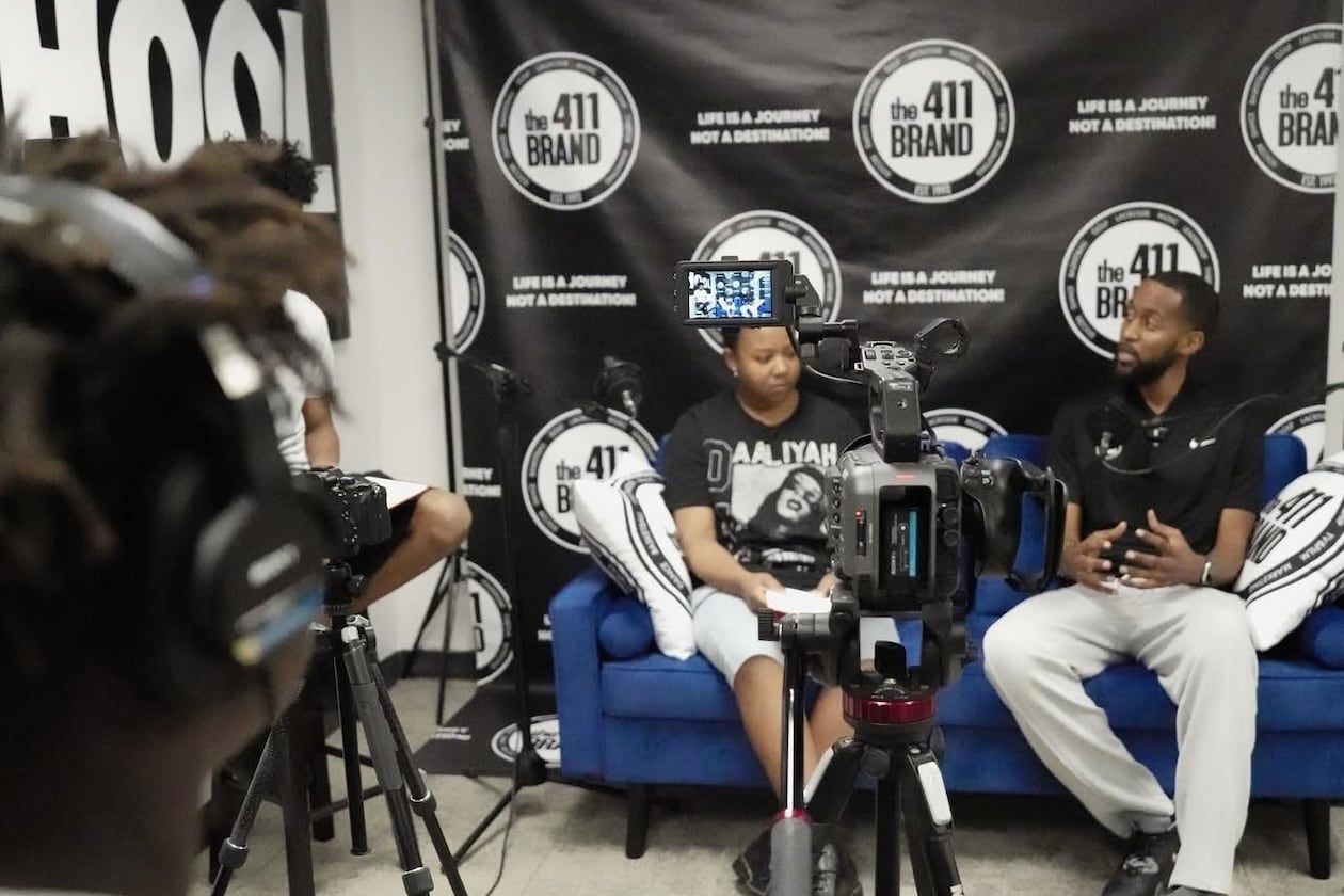 Paris Giles, 15 (left), interviews a guest for a class podcast at The 411 Brand Saturday School in Atlanta. The 411 Brand is a nonprofit offering innovative programming in education, entertainment and athletics to middle and high school students. (Courtesy of The 411 Brand)