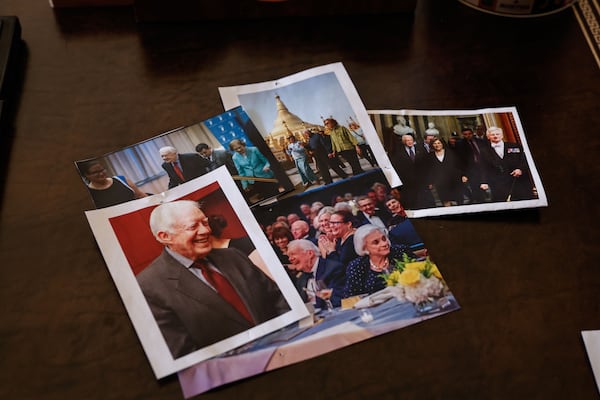 Photos of former president Jimmy Carter lie on his desk in his office at the Carter Center in Atlanta. (Natrice Miller/AJC)