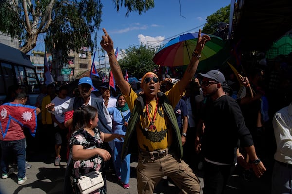 Pro-monarchy supporters take part in a rally calling for the restoration of Nepal's monarchy in Kathmandu, Nepal, Thursday, May 29, 2025. (AP Photo/Niranjan Shrestha)
