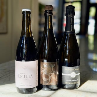 Sparkling wine recommendations for Thanksgiving. Limoges Cellars ‘Emilia’ Sparkling Red (left), Eric Bordelet Cider (center) and Domaine François Chidaine Montlouis-Sur-Loire Brut Nature (right). (Krista Slater for the AJC)