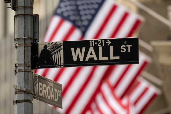 Wall St sign is seen outside the New York Stock Exchange, Thursday, April 10, 2025, in New York. (AP Photo/Yuki Iwamura)