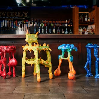 Designed by artist Julian Scalia, each stool visually represents a key symptom associated with colon cancer and features QR codes linking to screening info. (Ben Rollins/Courtesy of Chemistry Advertising)