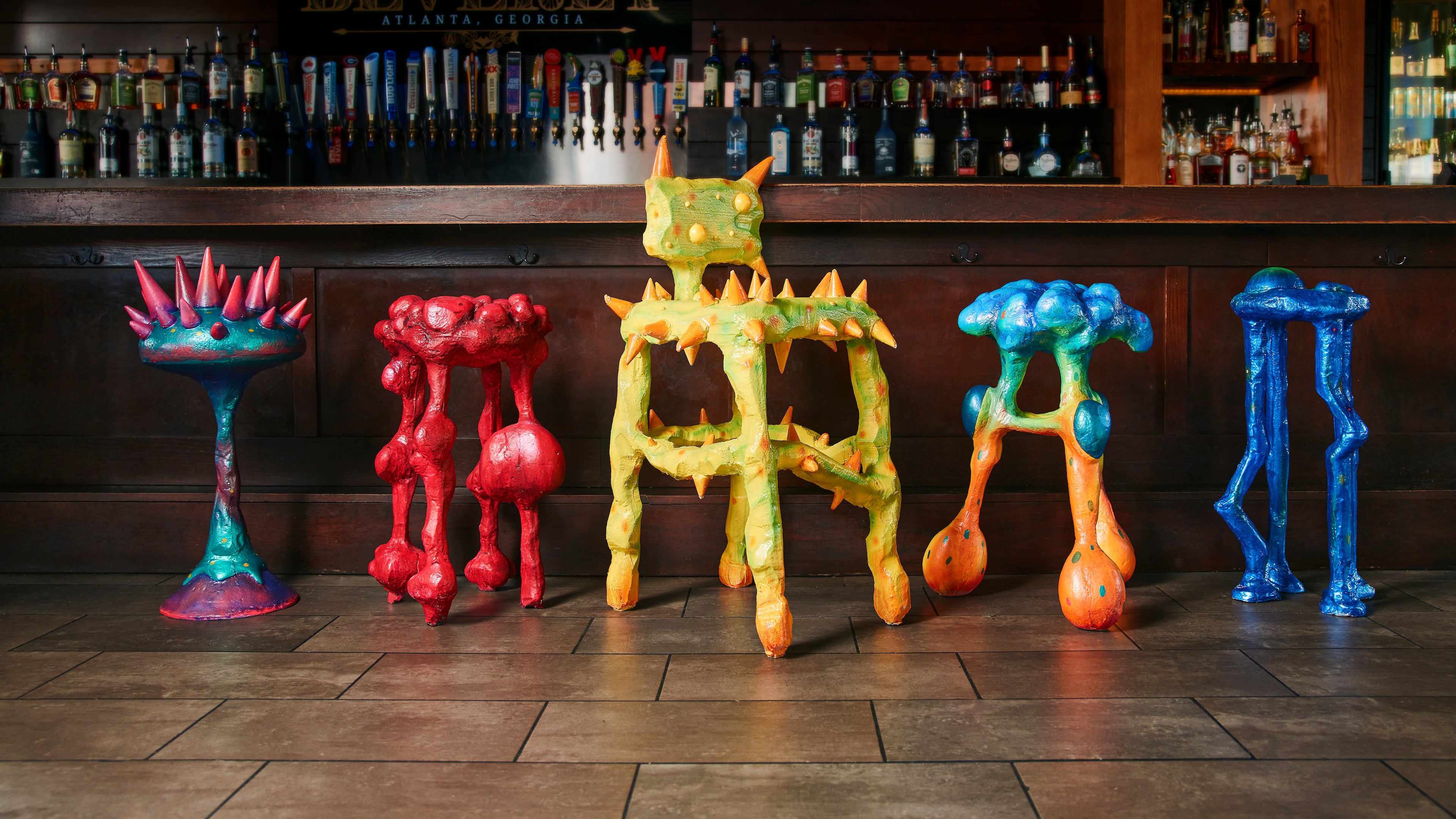 Designed by artist Julian Scalia, each stool visually represents a key symptom associated with colon cancer and features QR codes linking to screening info. (Ben Rollins/Courtesy of Chemistry Advertising)