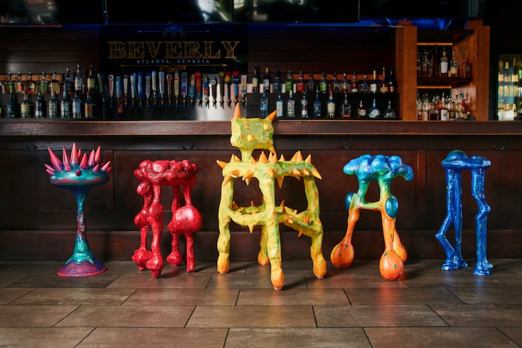 Designed by artist Julian Scalia, each stool visually represents a key symptom associated with colon cancer and features QR codes linking to screening info. (Ben Rollins/Courtesy of Chemistry Advertising)