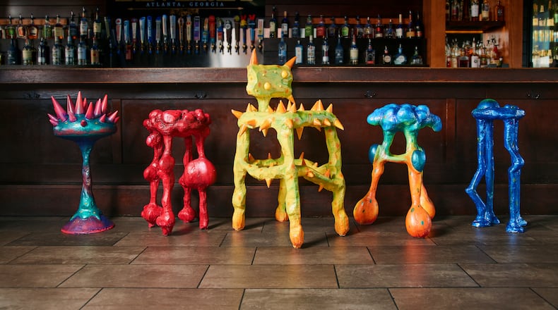 Designed by artist Julian Scalia, each stool visually represents a key symptom associated with colon cancer and features QR codes linking to screening info. (Ben Rollins/Courtesy of Chemistry Advertising)