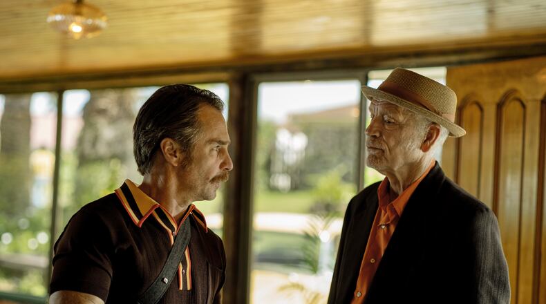 This image released by Searchlight Pictures shows Sam Rockwell, left, and John Malkovich in a scene from "Wild Horse Nine." (Diego Araya Corvalán/Searchlight Pictures via AP)
