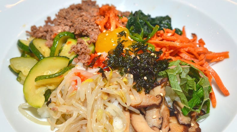The bibimbap, a Korean dish that means “mixed rice,” was royally prepared, writes Ligaya Figueras, the AJC’s senior editor of food and dining, who attended the gala celebration of the Korean harvest feast Chuseok, held Oct. 5, 2017, at the Westin Atlanta Perimeter North. (Chris Hunt/Special for The AJC)