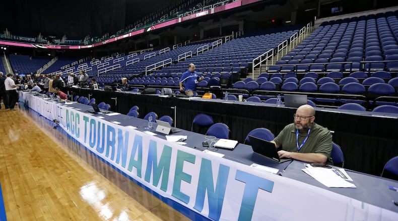 Greensboro Coliseum is mostly empty after the NCAA college basketball games were canceled at the Atlantic Coast Conference tournament Thursday, March 12, 2020,  in Greensboro, N.C.