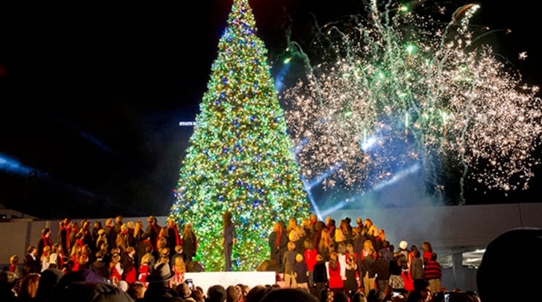 November 28, 2013 Atlanta - Fireworks explode in the air above the 56 foot tree during the 66th annual Macy's Great Tree Lighting at Lenox Square Mall in Atlanta on Thursday, November 28, 2013. Thousands of people came out to watch performances by Brett Eldredge, Judith Hill, Megan Hilty and others as well as drink hot chocolate, see Santa and of course watch the lighting of the 56 foot tree. JONATHAN PHILLIPS / SPECIAL