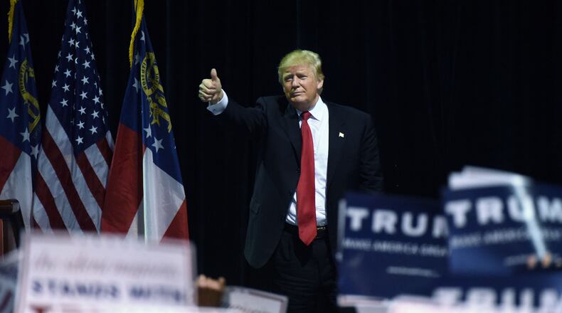 Republican frontrunner Donald Trump gives the thumbs up after his February speech at Georgia World Congress Center in Atlanta. Hyosub Shin, hshin@ajc.com