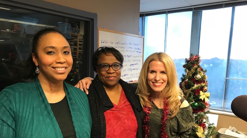 Marietta's Nicole Lassiter and Gloria Lassister were rewarded gifts to help them get through Christmas this year, courtesy of Fish 104.7. Afternoon host Beth Bacall was able to make the announcement. CREDIT: Rodney Ho/rho@ajc.com