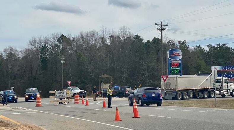 A Georgia State Patrol trooper opened fire on a driver who sideswiped his patrol car during a chase on Ga. 57, the GBI said.