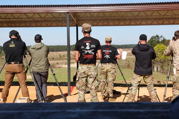 Sniper cadres and others watch during the International Sniper Competition at Fort Benning near Columbus on April 8, 2026. (Arvin Temkar/AJC)