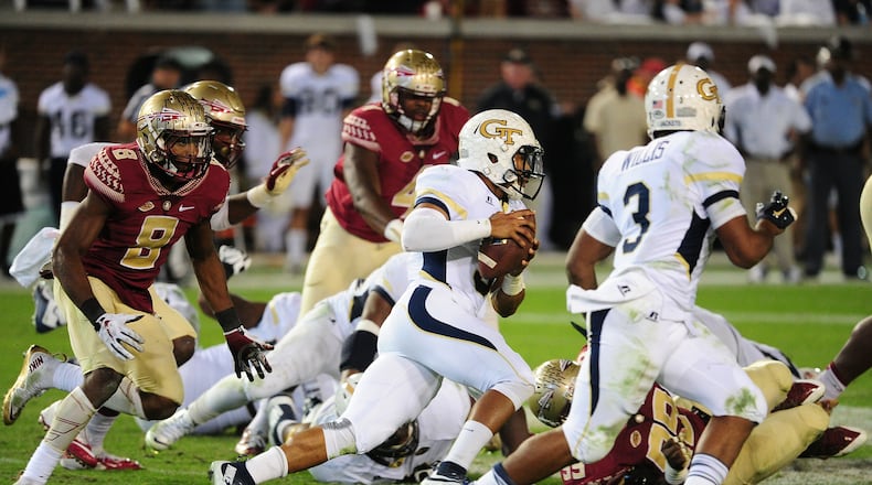 ATLANTA, GA - OCTOBER 24: Justin Thomas #5 of the Georgia Tech Yellow Jackets carries the ball for a 60 yard touchdown against the Florida State Seminoles on October 24, 2015 at Bobby Dodd Stadium in Atlanta, Georgia. Photo by Scott Cunningham/Getty Images)