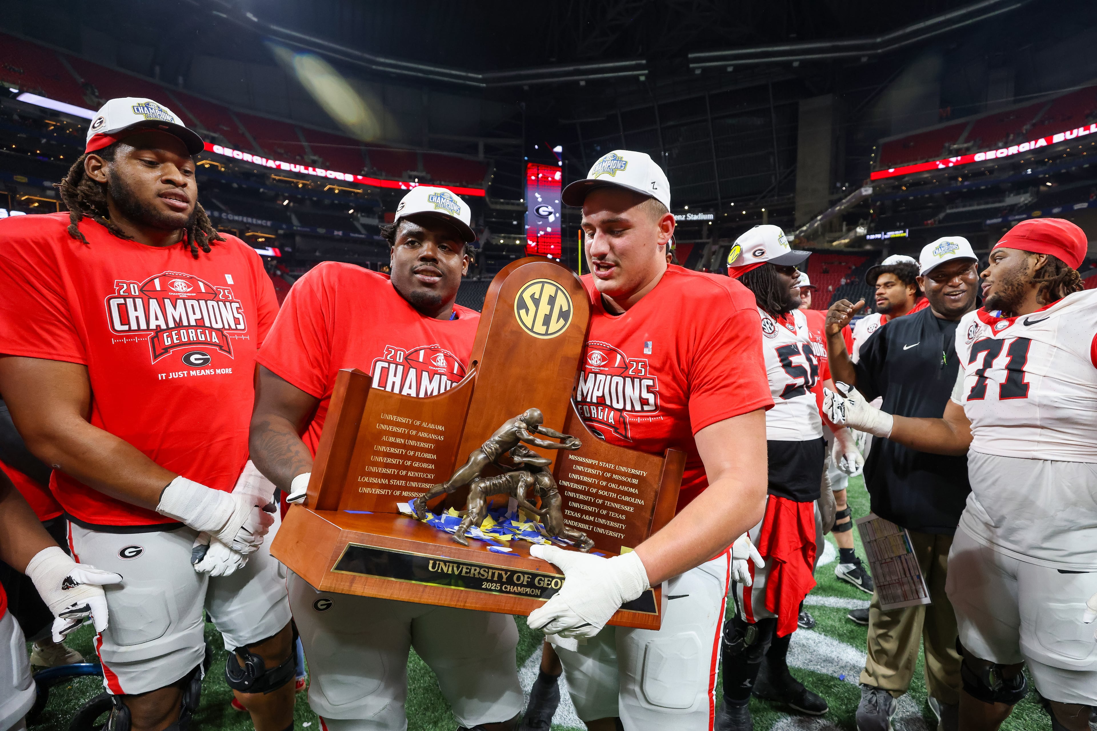 Georgia celebrates a 28-7 victory over Alabama in the SEC Championship game at Mercedes-Benz Stadium, Saturday, Dec. 6, 2025, in Atlanta. (Jason Getz / AJC)
