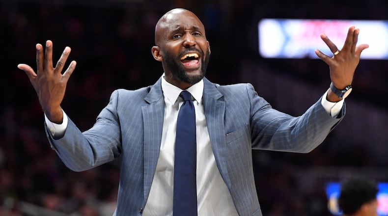 Atlanta Hawks coach Lloyd Pierce wants a foul called as he reacts toward an official during the second half of an NBA basketball game against the Milwaukee Bucks, Friday, Dec. 27, 2019, in Atlanta. (AP Photo/John Amis)