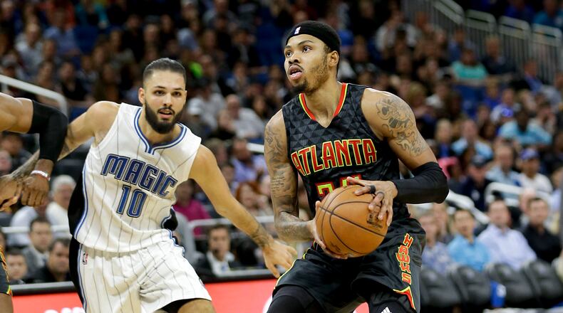 Atlanta Hawks’ Kent Bazemore, right, looks for a shot as he gets past Orlando Magic’s Evan Fournier (10) during the second half of an NBA basketball game, Wednesday, Jan. 4, 2017, in Orlando, Fla. Atlanta won 111-92. (AP Photo/John Raoux)