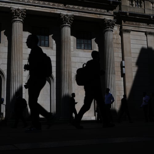 FILE -Pedestrians walk past the Bank of England in London, April 30, 2026. (AP Photo/Kirsty Wigglesworth, File)