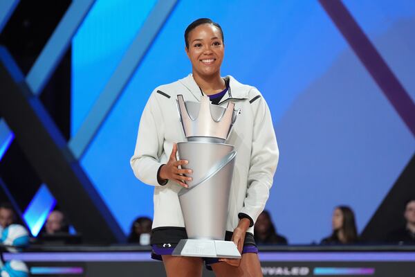 Lunar Owls forward Napheesa Collier holds her trophy after being named Unrivaled's Most Valuable Player, ahead of the Unrivaled 3-on-3 basketball semifinals, Sunday, March 16, 2025, in Medley, Fla. (AP Photo/Rebecca Blackwell)