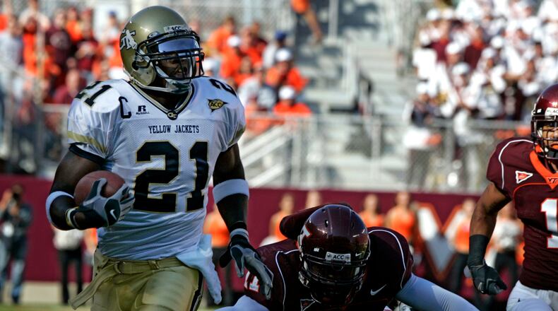 ** RETRANSMISSION TO CORRECT OBJECT NAME AND PLAYER ** Georgia Tech wide receiver Calvin Johnson (21) runs is for a touchdown as Virginia Tech defender Xavier Adibi (11) makes a last attempt for a tackle during first half action of the Georgia Tech-Va Tech Atlantic Coast Conference college football game at Lane stadium in Blacksburg, Va., Saturday Sept. 30, 2006. (AP Photo/Steve Helber)