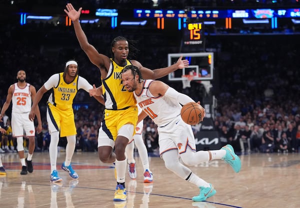 New York Knicks guard Jalen Brunson (11) drives against Indiana Pacers guard Andrew Nembhard (2) during the third quarter of Game 2 of the NBA basketball Eastern Conference final, Friday, May 23, 2025, in New York. (AP Photo/Frank Franklin II)