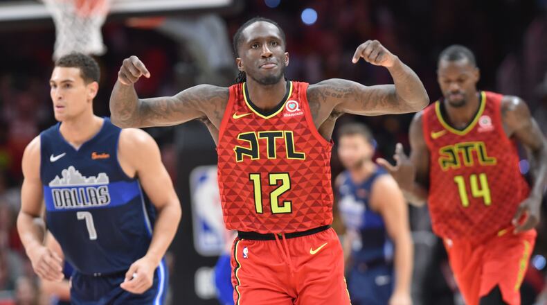Atlanta Hawks forward Taurean Prince (12) reacts after he scored during the second half of the home opener in an NBA basketball game at State Farm Arena on Wednesday, October 24, 2018. HYOSUB SHIN / HSHIN@AJC.COM