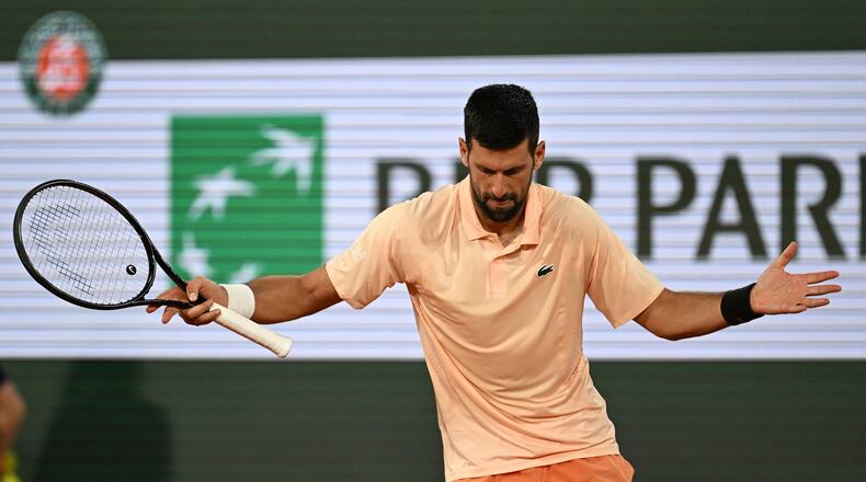 Novak Djokovic of Serbia celebrates after winning the first round men's singles tennis match against against Giovanni Mpetshi Perricard of France at the French Open tennis tournament in Paris, Sunday, May 24, 2026. (AP Photo/Emma Da Silva)