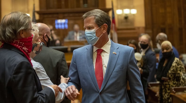 Gov. Brian Kemp is greeted as he visits the chambers of the Georgia House of Representatives on the final day the 2020 legislative session in Atlanta. Expecting a huge plunge in revenue, the General Assembly cut spending by $2.2 billion for the fiscal year that began July 1. Now, it looks like the state has fared much better, so far, in the pandemic recession. (ALYSSA POINTER / ALYSSA.POINTER@AJC.COM)