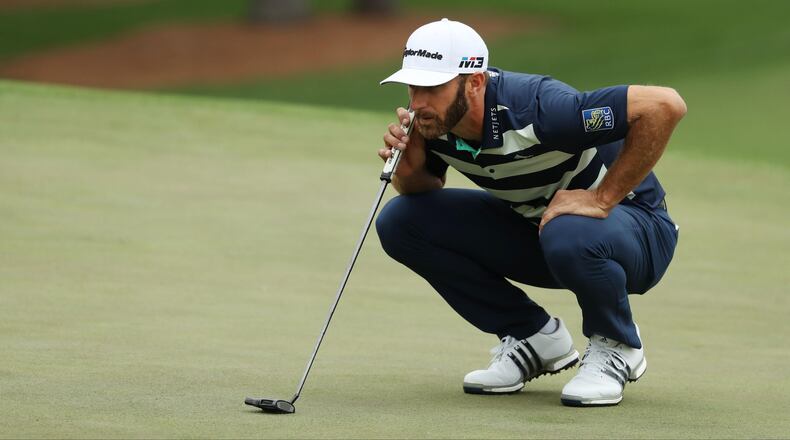 Dustin Johnson lines up his putt on seven during the third round of the Masters Tournament Saturday, April 7, 2018, at Augusta National Golf Club. PHOTO / JASON GETZ