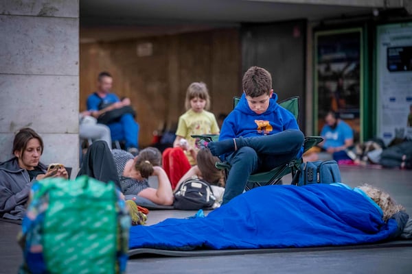 People hide in a metro station, being used as a bomb shelter, during a Russian drones attack in Kyiv, Ukraine, early hours Saturday, July 5, 2025. (AP Photo/Dan Bashakov)