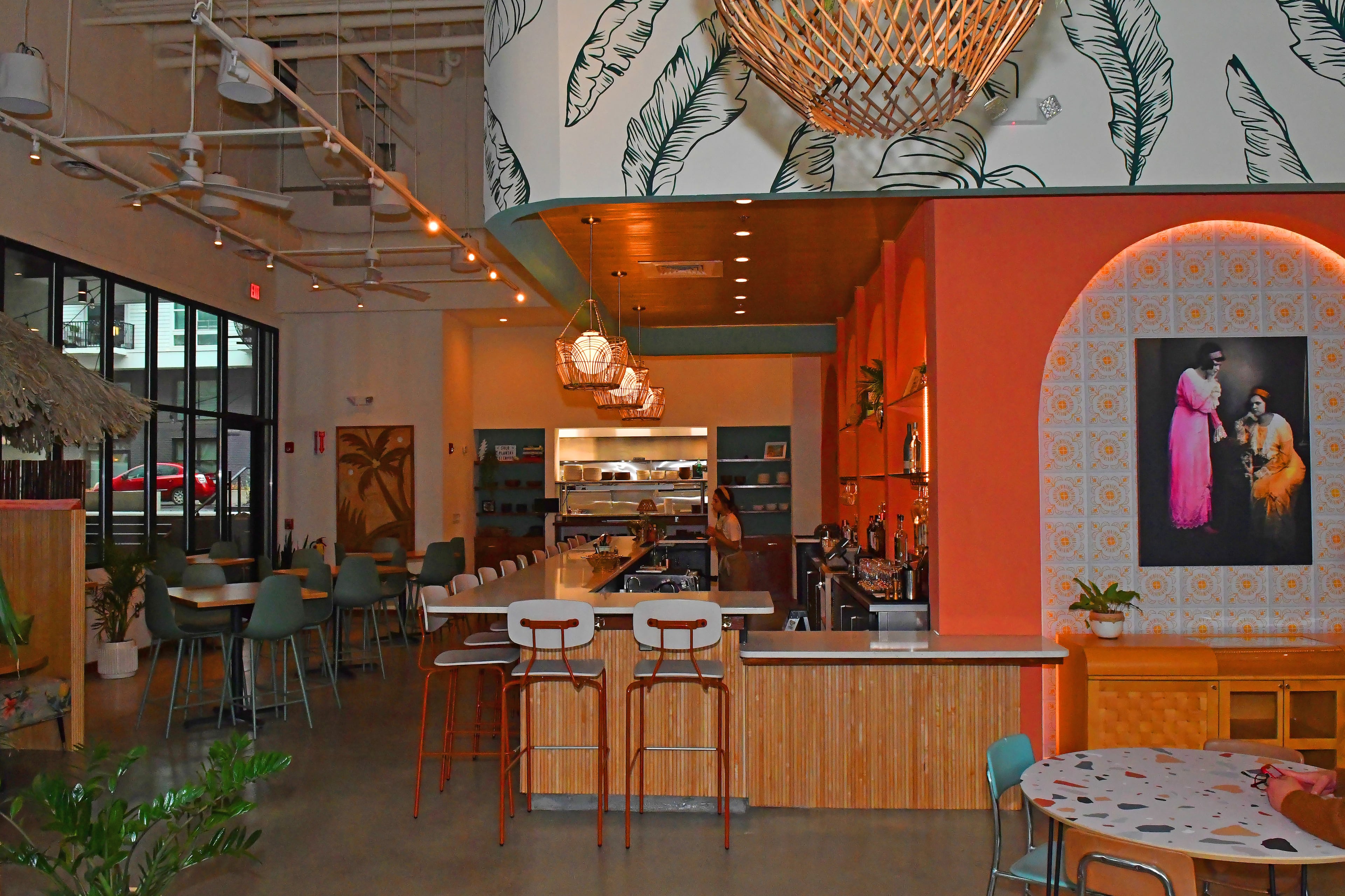 Calming natural tones, green foliage, rattan lighting and a straw hut booth combine to make La Semilla feel like a spa resort in the Yucatan Peninsula. (Chris Hunt for the AJC)
