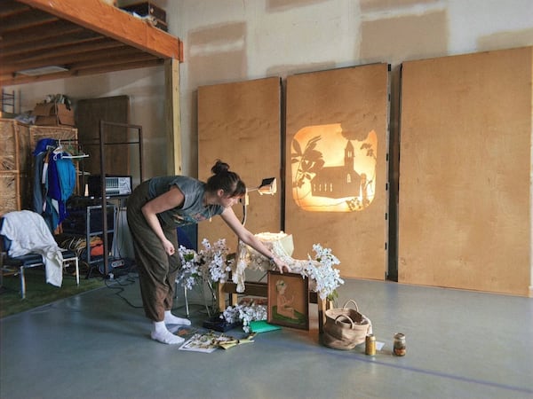 Emma Yarbrough plays with shadow puppetry in a rehearsal space while developing her play "Day," which is about her witty, artist aunt who was murdered 10 years ago. (Courtesy of Emma Yarbrough)