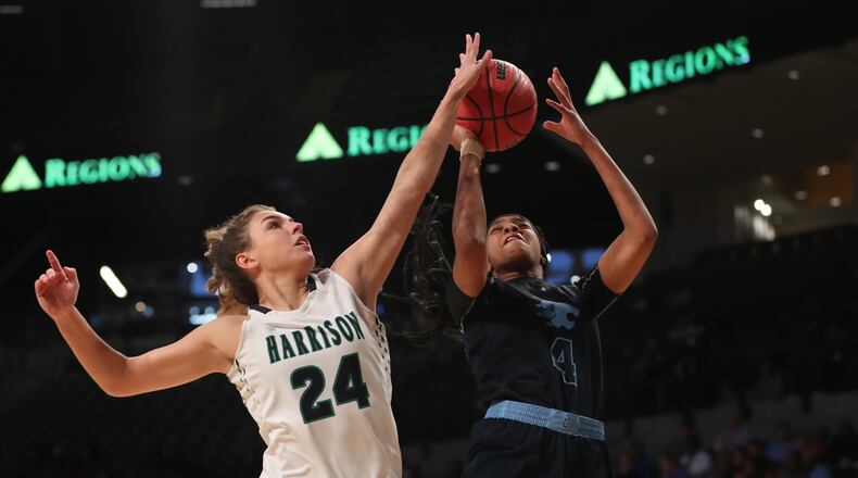 March 9, 2018 - Atlanta, Ga: Lovejoy guard Anaya Boyd (4) attempts a shot defended by Harrison guard Audrey Jordan (24) during the first half of the GHSA Class AAAAAA Girls State Championship at McCamish Pavilion Friday, March 9, 2018, in Atlanta. PHOTO / JASON GETZ