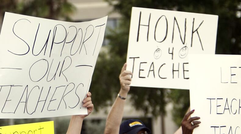 Report: teacher pay gap widens. (AJC File Photo)